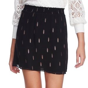 Black Smocked Metallic Print Mini Skirt Sz M NWT